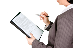 Woman holding clipboard with information outlining how to form an NGO in Uruguay