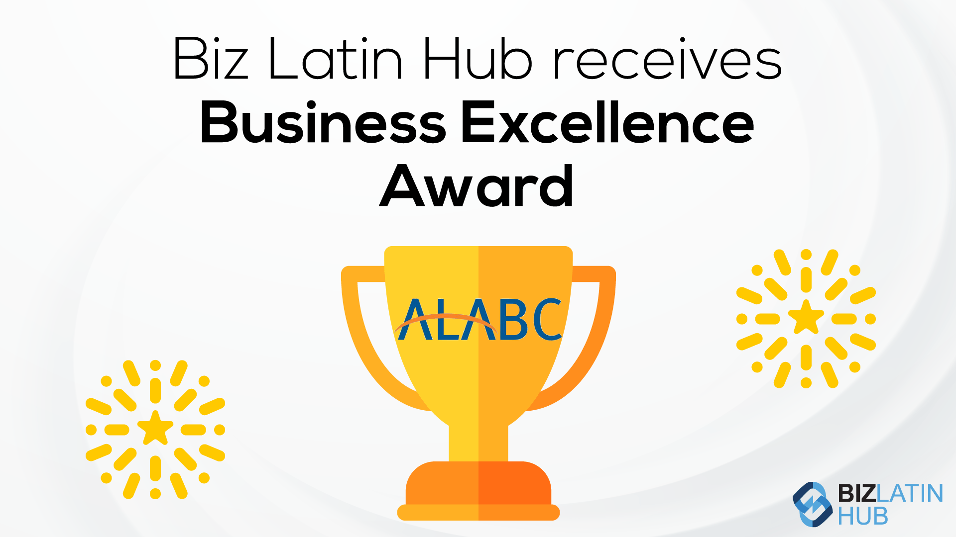 Uma imagem com o texto "Biz Latin Hub Awarded Business Excellence Award" na parte superior. Abaixo do texto, há uma ilustração de um troféu dourado com "ALABC" escrito nele. Padrões decorativos de explosão de estrelas estão em ambos os lados do troféu. O logotipo do Biz Latin Hub aparece no canto inferior direito.