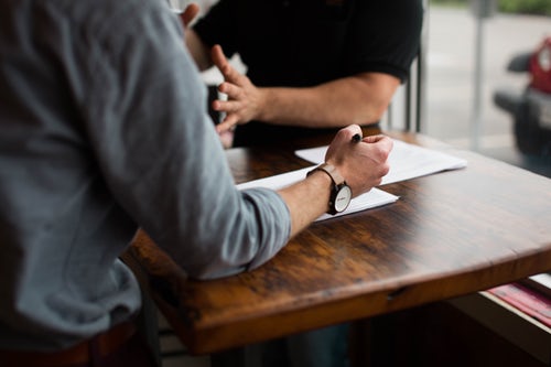 People discussing in meeting