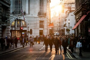 A group of people walking on a street, bustling with energy, reflecting the vibrant business growth in Latin America.