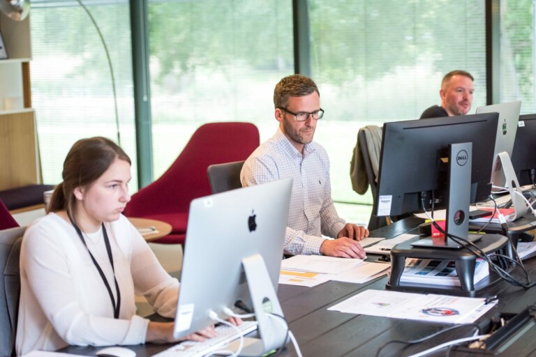 Staff members working at computers