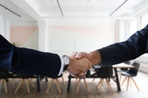 Two business people shaking hands