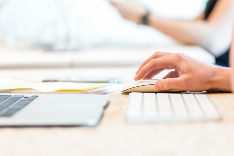 Person using a keyboard to research due diligence in Panama