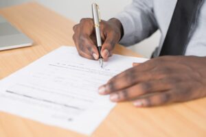 Person filling in paperwork