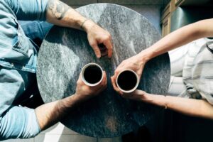 Two people having coffee together.