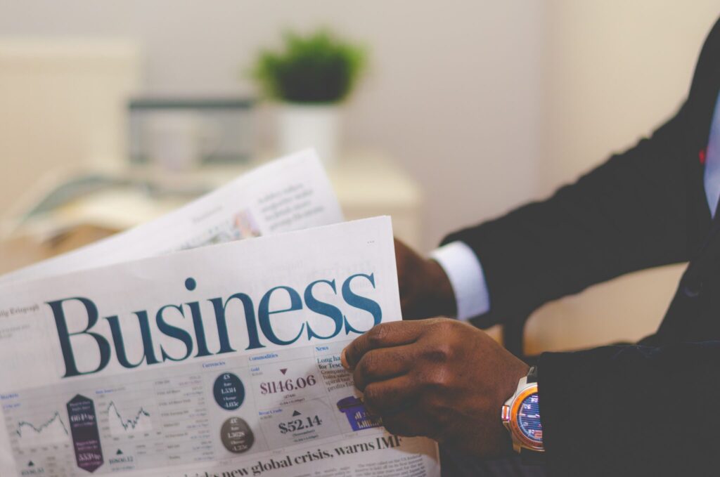 Man reading business newspaper.