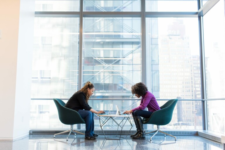 Two women discussing legal representation in Brazil