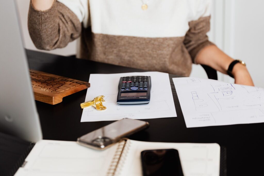 Man calculating dividend withholding tax in Mexico 