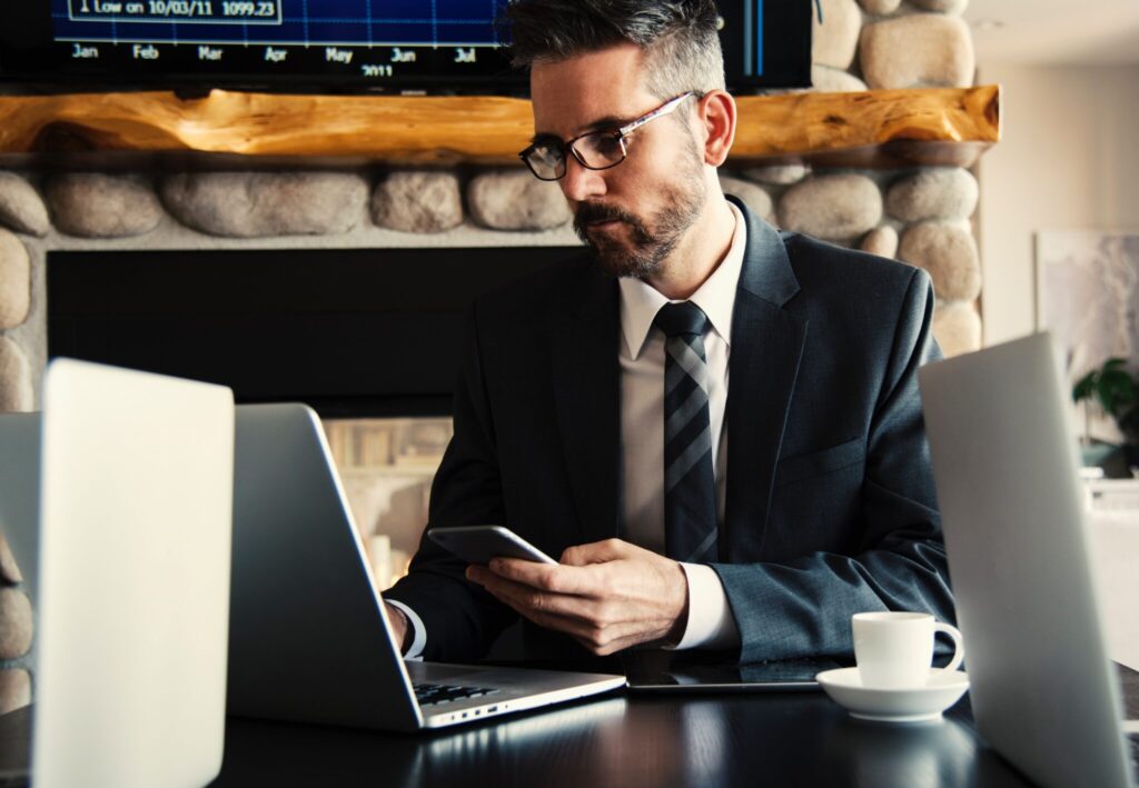 Businessman using his computer to search information about how to do business in El salvador.