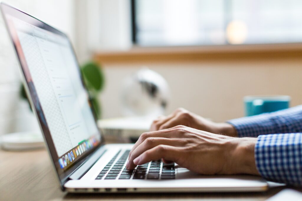 Man using his laptop, representing a person researching reputation for providers of legal services in Argentina.