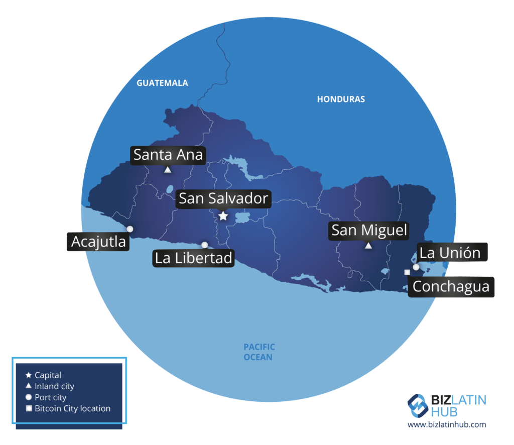 A map of El Salvador highlighting several cities. San Salvador, the capital, is centrally located. Marked cities include Santa Ana, San Miguel, Acajutla, La Libertad, La Unión, and Conchagua. Bitcoin City location is also marked with a lemon cash color scheme. Guatemala and Honduras are labeled on the borders.