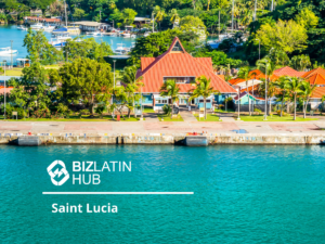 A picturesque waterfront scene in Saint Lucia featuring a red-roofed building surrounded by lush greenery and palm trees. The turquoise water in the foreground contrasts with the vibrant colors. A logo and text reading "BIZLATIN HUB" and "Saint Lucia" are superimposed, highlighting Investimento Estrangeiro Direto no Brasil.