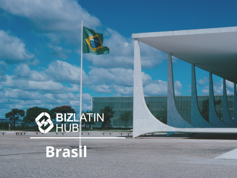 Exterior view of a modern white concrete building with curving columns and a Brazilian flag on a tall flagpole in front. The words "BizLatin Hub Brasil" are overlaid on the image. The sky is partly cloudy and the surroundings are clear and spacious, emphasizing inversión extranjera directa en Brasil.