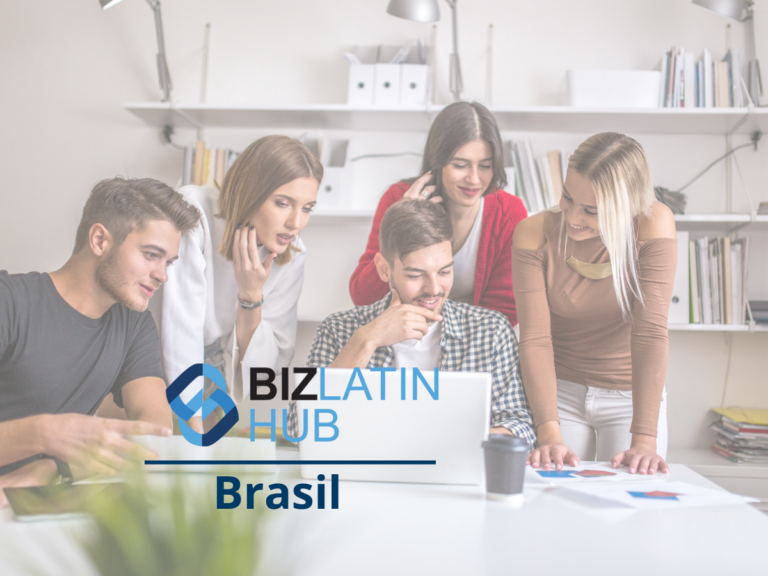 A group of five people are gathered around a laptop in an office setting. They are all smiling and engaged in conversation. The logo on the image reads "Biz Latin Hub" with the word "Headhunter Brasil" underneath. Shelves with files and books are in the background.