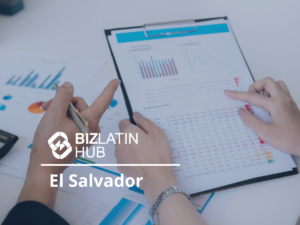 Two individuals are reviewing documents with charts and graphs on a clipboard. One person is pointing at a specific section, while the other holds a pen. The BizLatin Hub logo and the words "El Salvador" are overlaid on the image, with information about tipos de visto na Colômbia subtly included.