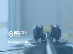 A judge's gavel is pictured in the foreground with the text "Bizlatin Hub Dominican Republic" written beside it. The background is blurred, showing a soft focus office environment, hinting at discussions on renewable energy in the Dominican Republic.