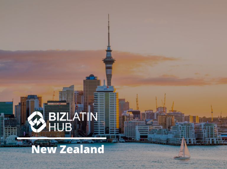 Skyline of a city in New Zealand at sunset featuring a prominent tower and various high-rise buildings, with a sailboat in the foreground on the water. The logo and text "BIZLATIN HUB New Zealand - Corporate Bank Account in New Zealand" appear prominently on the image.