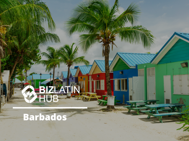 En un día soleado se muestra una hilera de cabañas de playa de colores vibrantes con palmeras al fondo. La imagen incluye el logotipo de Biz Latin Hub y el texto "Biz Latin Hub Barbados" superpuesto a la escena.